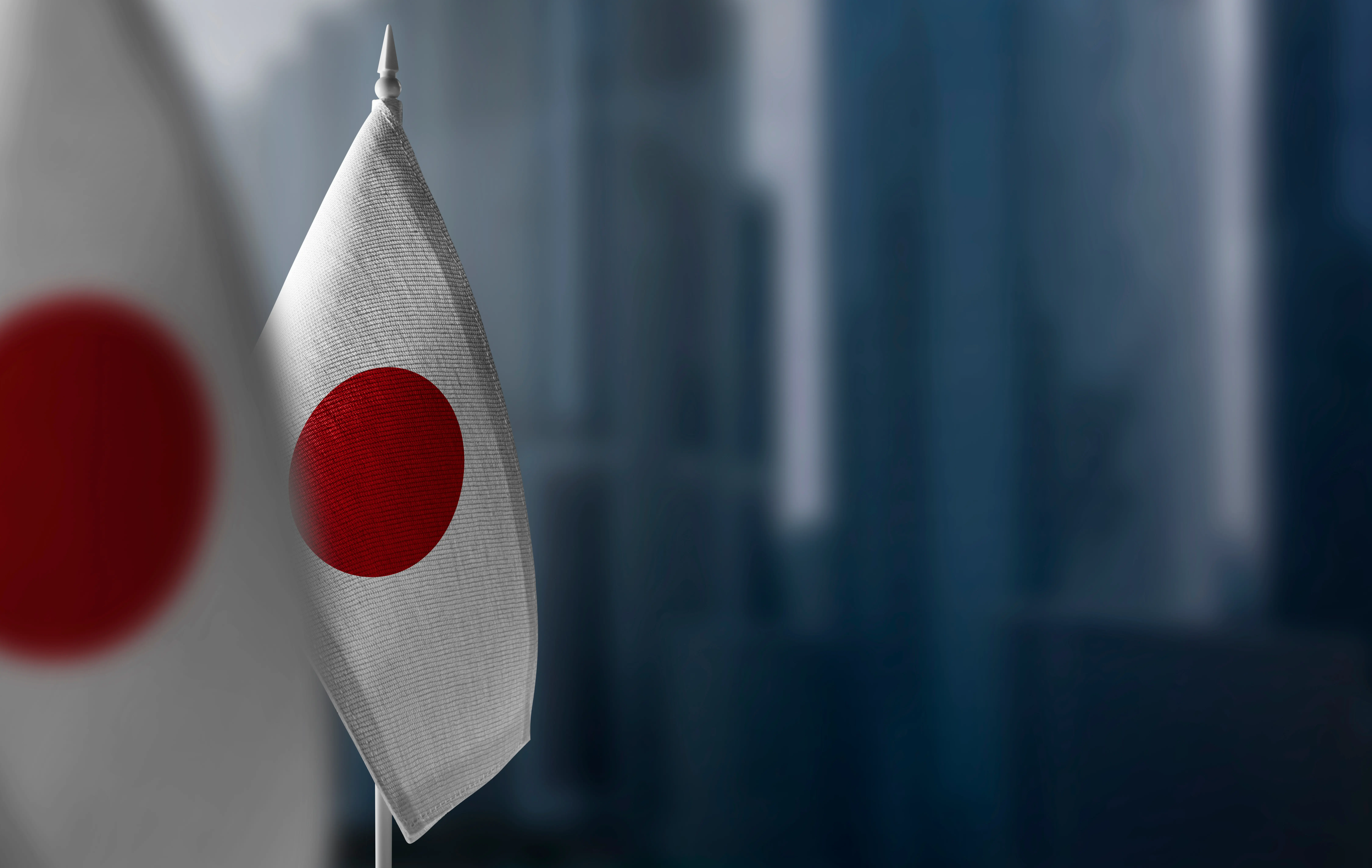 Bandeira do Japão, corte de taxa do banco do Japão, banco do Japão mantém a taxa de juros inalterada