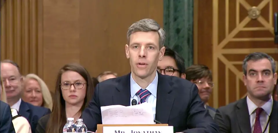 Jonathan Gould speaking at a nomination hearing before the Senate Banking Committee in March